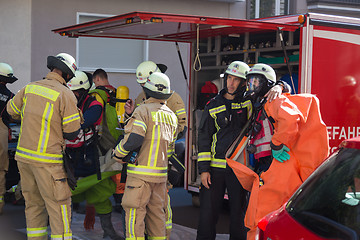 Image showing Firefighters getting ready to intervene on chemical accident location.