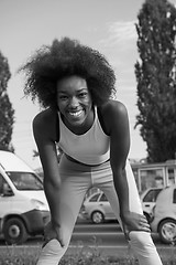 Image showing Portrait of sporty young african american woman running outdoors