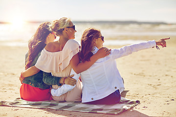 Image showing group of smiling women in sunglasses on beach