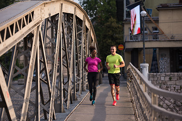 Image showing multiethnic couple jogging in the city