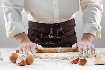 Image showing Hands kneading a dough