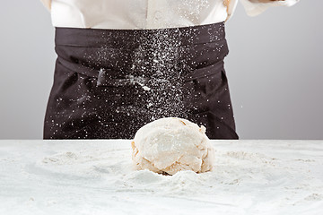 Image showing Hands kneading a dough