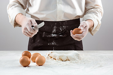 Image showing Hands kneading a dough