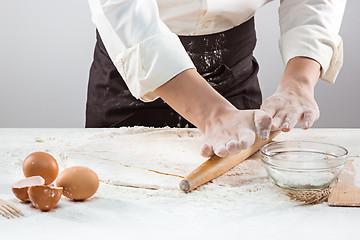 Image showing Hands kneading a dough