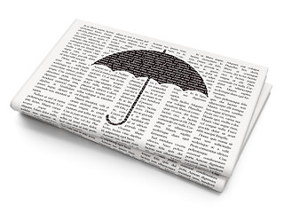 Image showing Protection concept: Umbrella on Newspaper background
