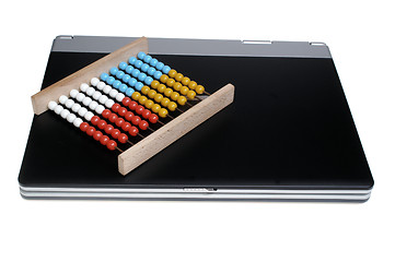 Image showing Laptop and abacus