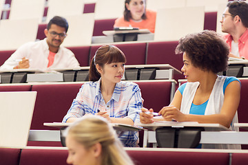 Image showing group of students talking in lecture hall