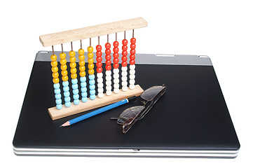 Image showing Laptop and abacus