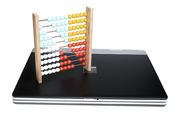 Image showing Laptop and abacus