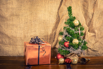 Image showing Christmas gift on a wooden table