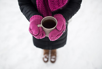 Image showing close up of woman with tea mug outdoors in winter