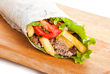 Image showing beef burrito with peppers, fried potato and tomato