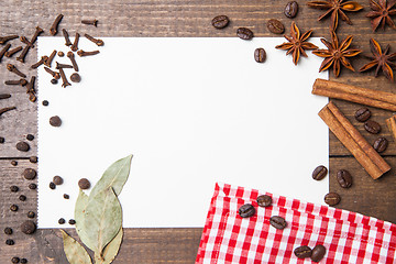 Image showing paper for recipes and spices on wooden table