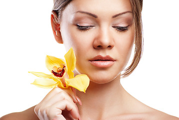 Image showing young beautiful woman with orchid