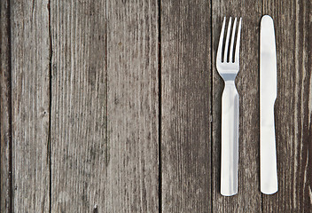 Image showing Knife and fork  on old wooden table