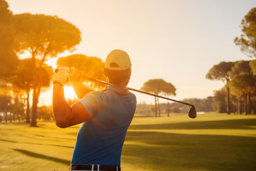 Image showing golf player hitting shot with club