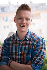 Image showing man standing at balcony