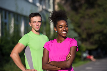 Image showing portrait of young multietnic jogging couple ready to run