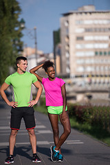 Image showing portrait of young multietnic jogging couple ready to run