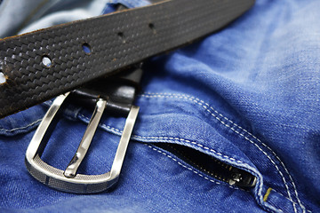 Image showing Blue jeans with black leather belt