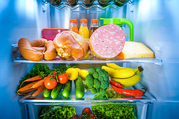 Image showing Open refrigerator filled with food