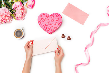 Image showing The female hands with envelope on white background