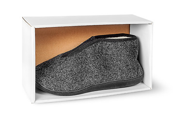 Image showing Single slipper in white cardboard box