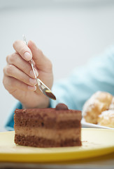 Image showing Woman eating chocolate cake