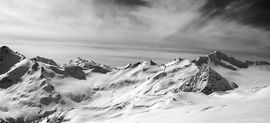 Image showing Black and white panorama of Caucasus Mountains in snow winter ev