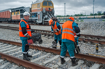 Image showing Railway workers repairing railway