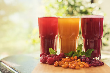 Image showing fruit drink with cranberries raspberries and sea buckthorn