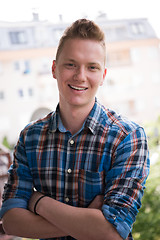 Image showing man standing at balcony