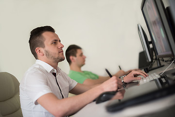 Image showing a group of graphic designers at work