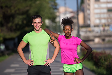 Image showing portrait of young multietnic jogging couple ready to run