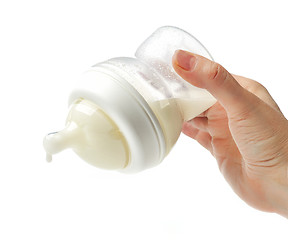 Image showing baby milk bottle in mother hand