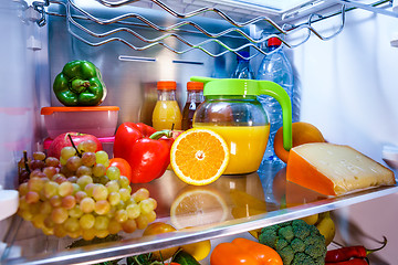 Image showing Open refrigerator filled with food