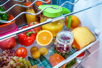 Image showing Open refrigerator filled with food