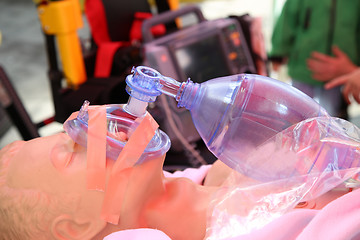 Image showing Practicing to use an oxygen mask on training doll