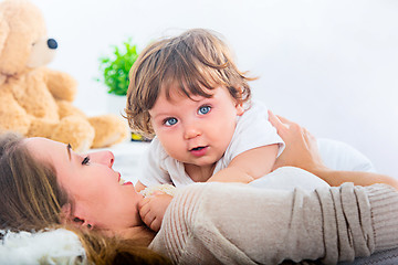 Image showing Happy woman with son - baby boy