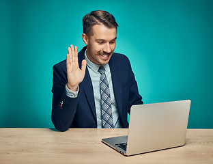 Image showing Sad Young Man Working On Laptop At Desk