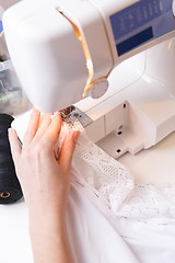 Image showing Dressmaker doing lines on sewing-machine