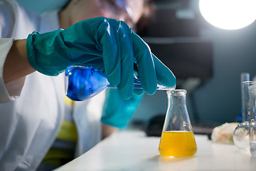 Image showing Laboratory assistant carries chemical experiments