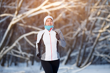 Image showing Sport woman in winter forest