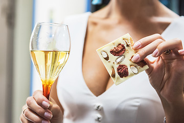 Image showing Girl with wine and chocolate