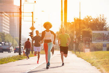 Image showing multiethnic group of people on the jogging