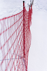 Image showing Plastic fence and snow.