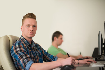 Image showing a group of graphic designers at work