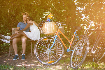 Image showing Young multiethnic couple having a bike ride in nature