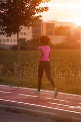 Image showing a young African American woman jogging outdoors