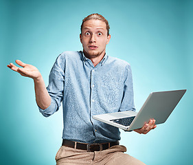 Image showing Sad Young Man Working On Laptop